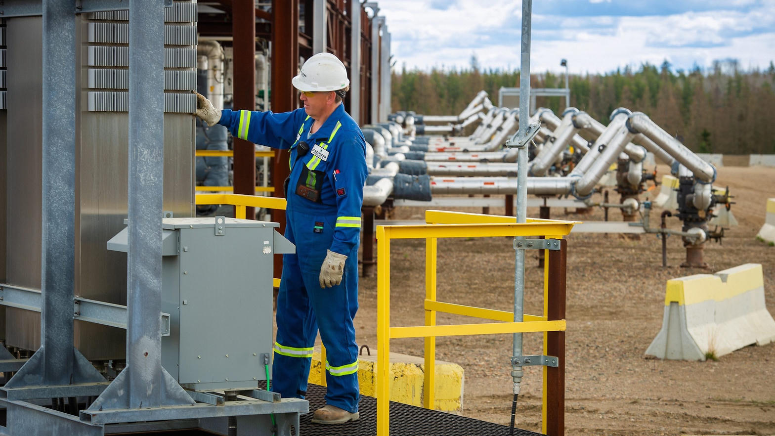 Crew in safety gear on a prairie oil site